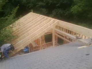 Framing a new roof addition that ties into an existing shingle roof in Romeo